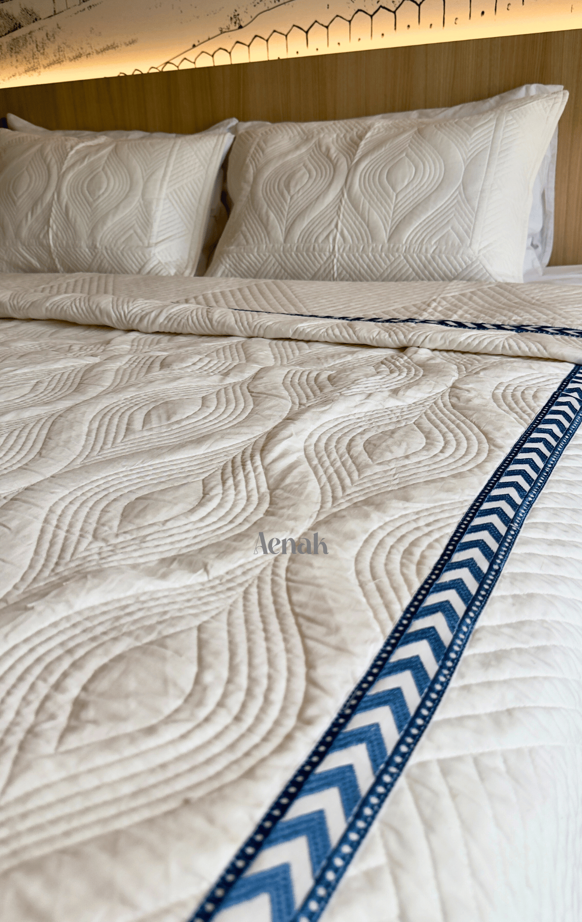 White Embossed Quilted Bedcover with Blue Lace