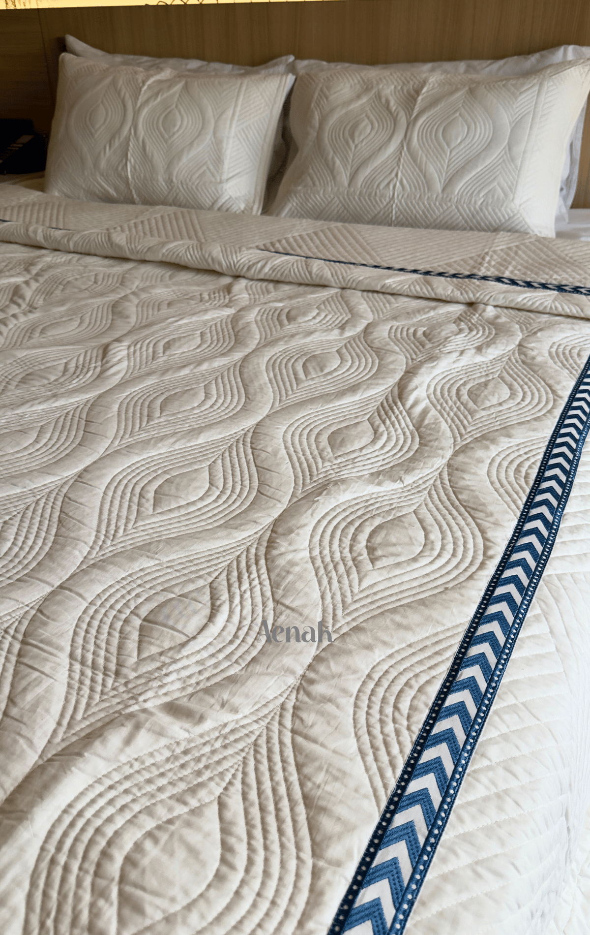 White Embossed Quilted Bedcover with Blue Lace