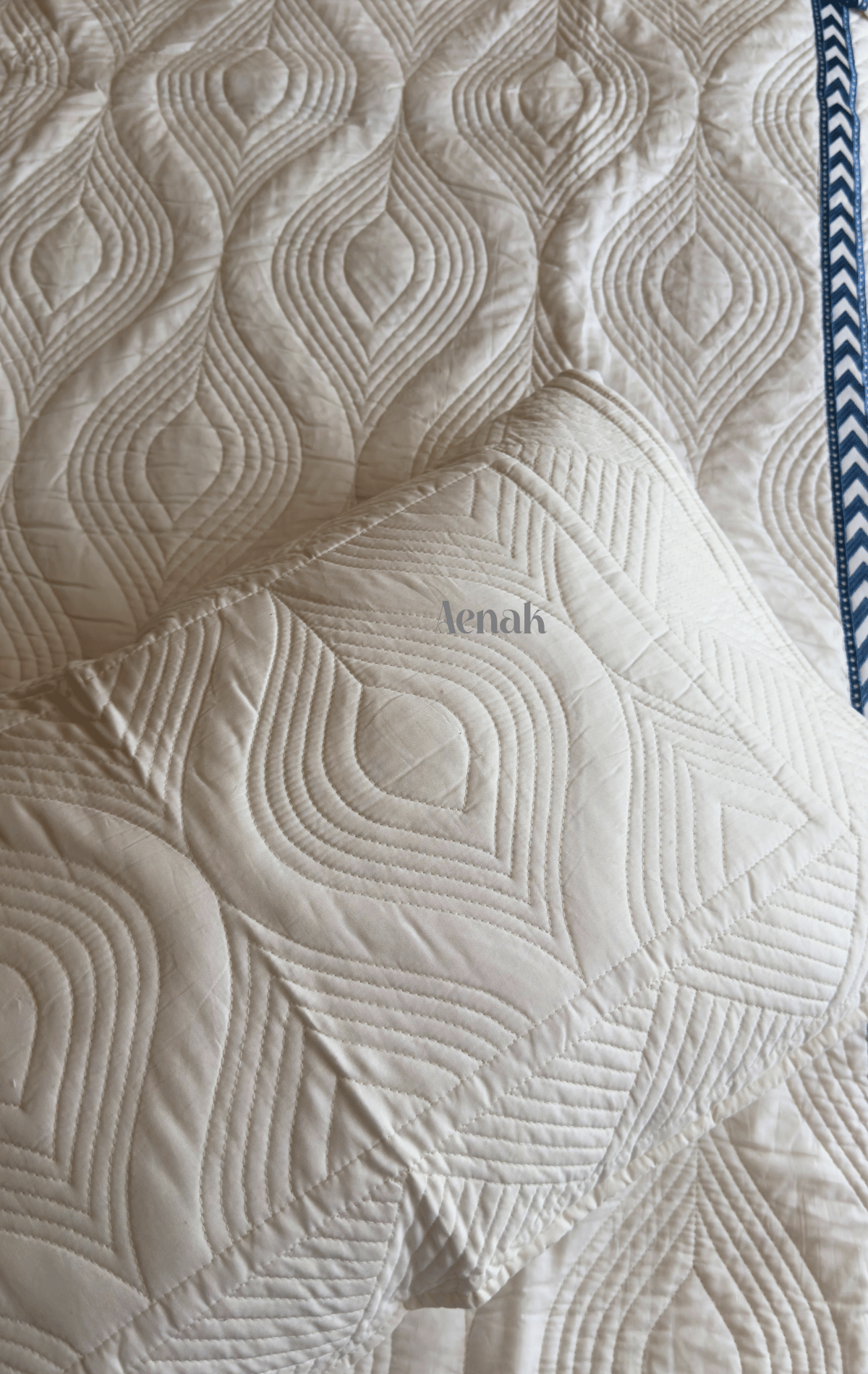 White Embossed Quilted Bedcover with Blue Lace