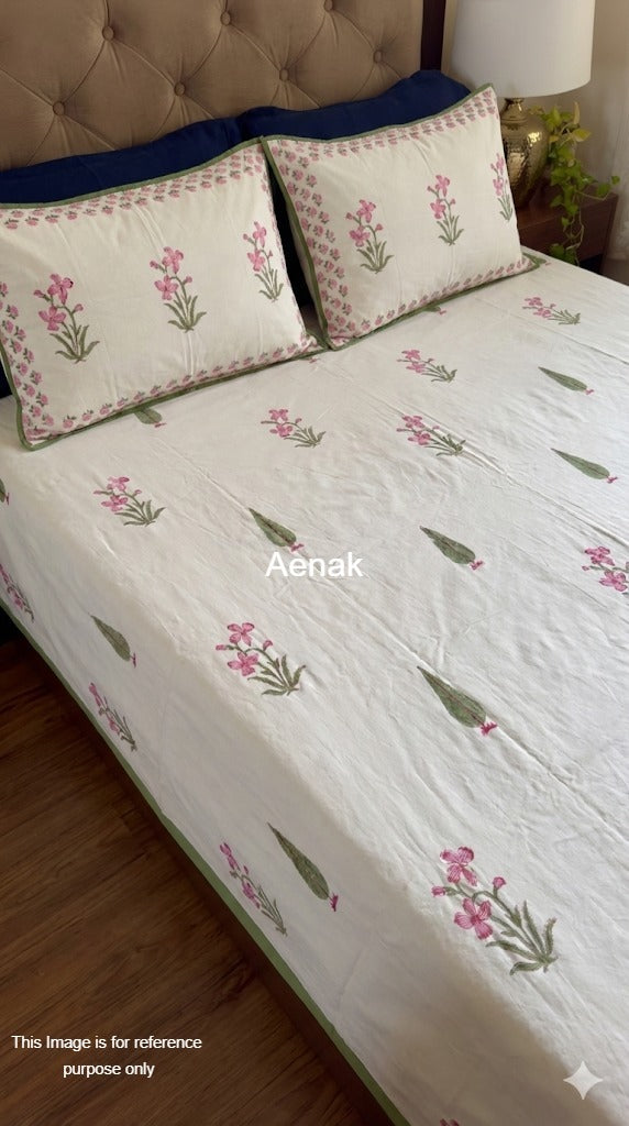 Handblock printed cotton bedsheet with reversible pillow covers in pink and green