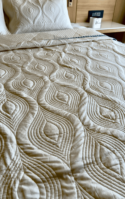 White Embossed Quilted Bedcover with Blue Lace