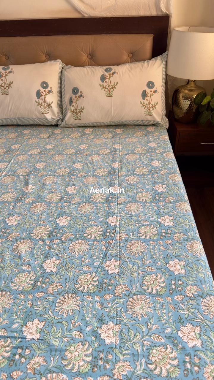 Handblock printed cotton bedsheet with reversible pillow covers in yellow and blue