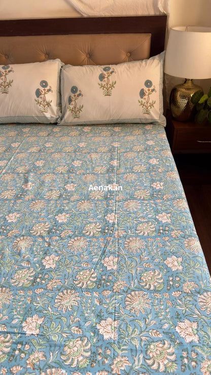 Handblock printed cotton bedsheet with reversible pillow covers in yellow and blue