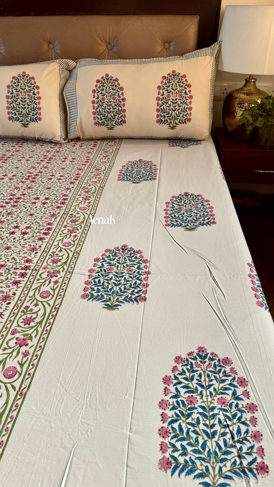 Premium cotton bedsheet with reversible pillow covers in beige pink and green print