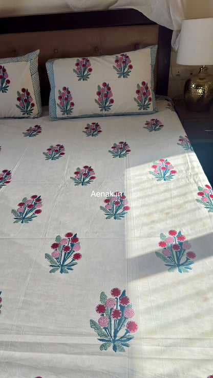 Handblock printed cotton bedsheet with reversible pillow covers in green and pink