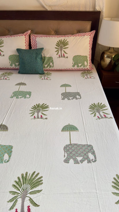 Handblock printed cotton bedsheet with reversible pillow covers in green and pink