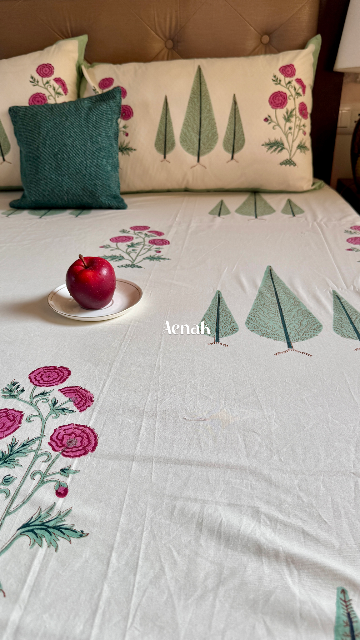Handblock printed cotton bedsheet with reversible pillow covers in ivory magenta and green