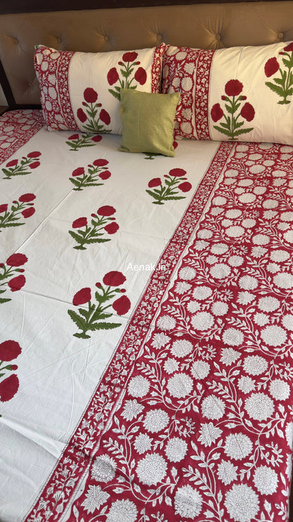 Red green premium cotton bedsheet for warm and festive bedroom styling by Aenak