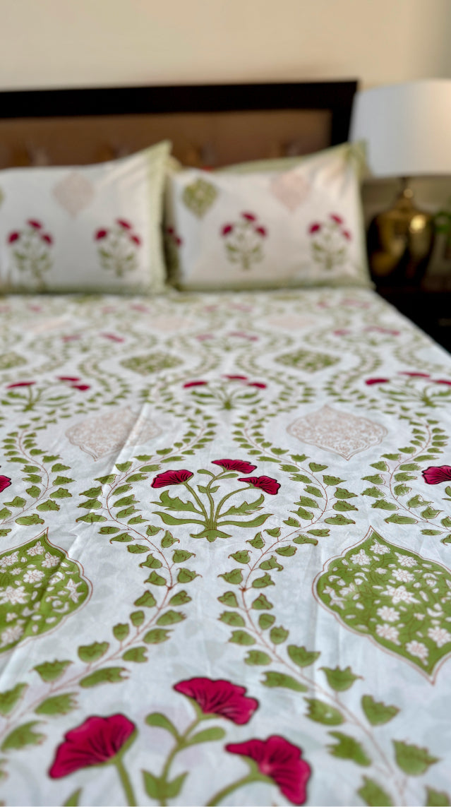 Handblock printed cotton bedsheet with reversible pillow covers in green and red