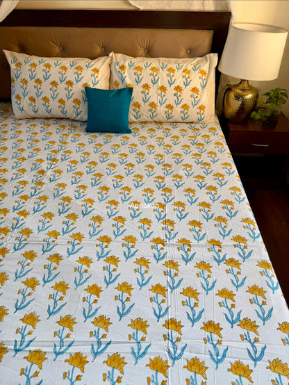 Aenak organic percale cotton bedsheet in yellow and blue handblock print
