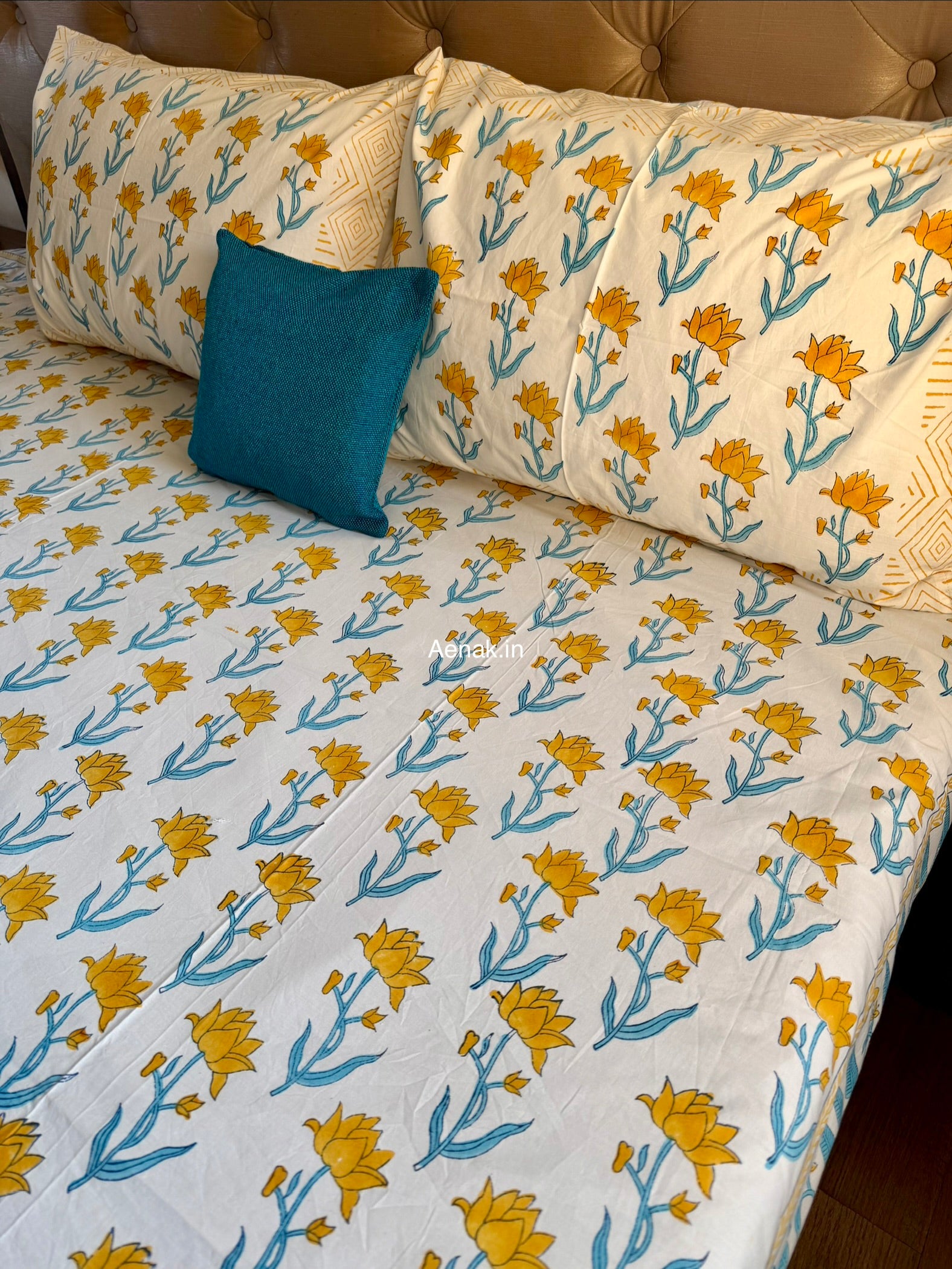 Handblock printed cotton bedsheet with reversible pillow covers in yellow and blue
