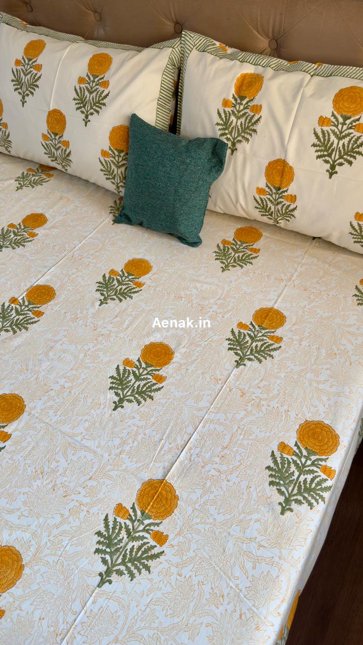 Handblock printed cotton bedsheet with reversible pillow covers in yellow and green