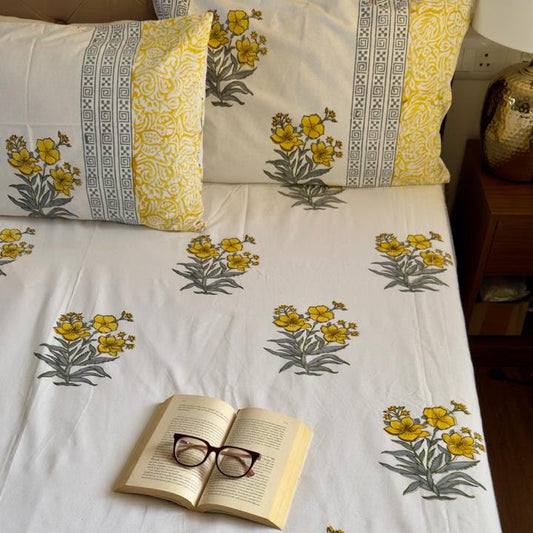 Yellow 300 TC premium cotton bedsheet with handblock prints by Aenak