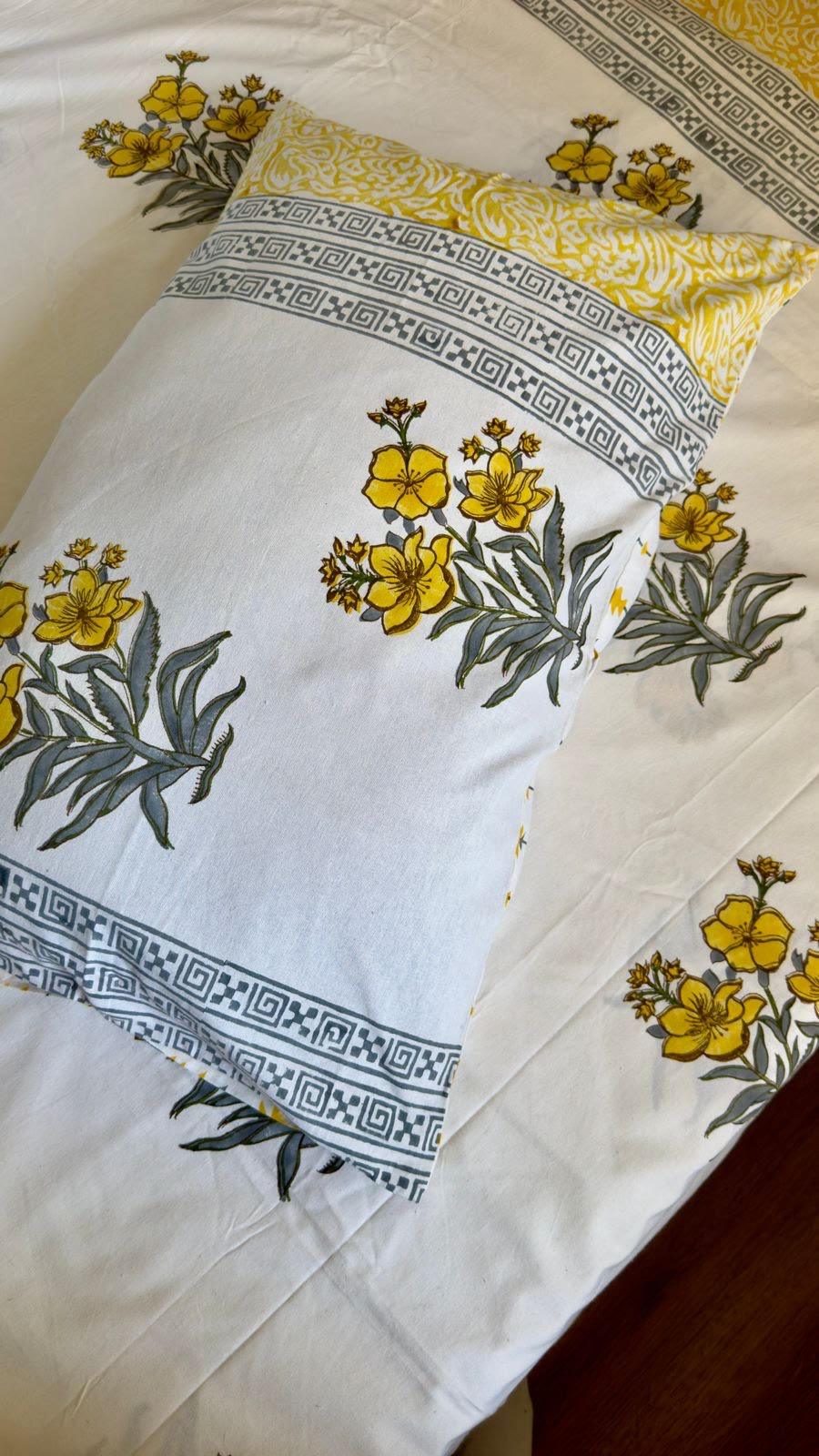 Handblock printed cotton bedsheet with reversible pillow covers in yellow