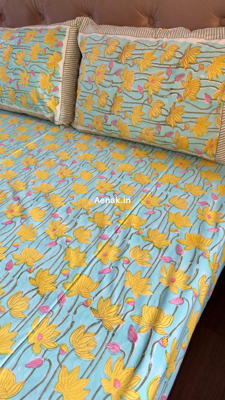 Handblock printed cotton bedsheet with reversible pillow covers in yellow blue and pink